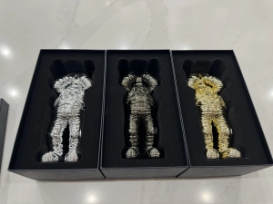 KAWS HOLIDAY SPACE FIGURE SET (GOLD SILVER & BLACK)- COMPLETE SET OF 4 FIGURES