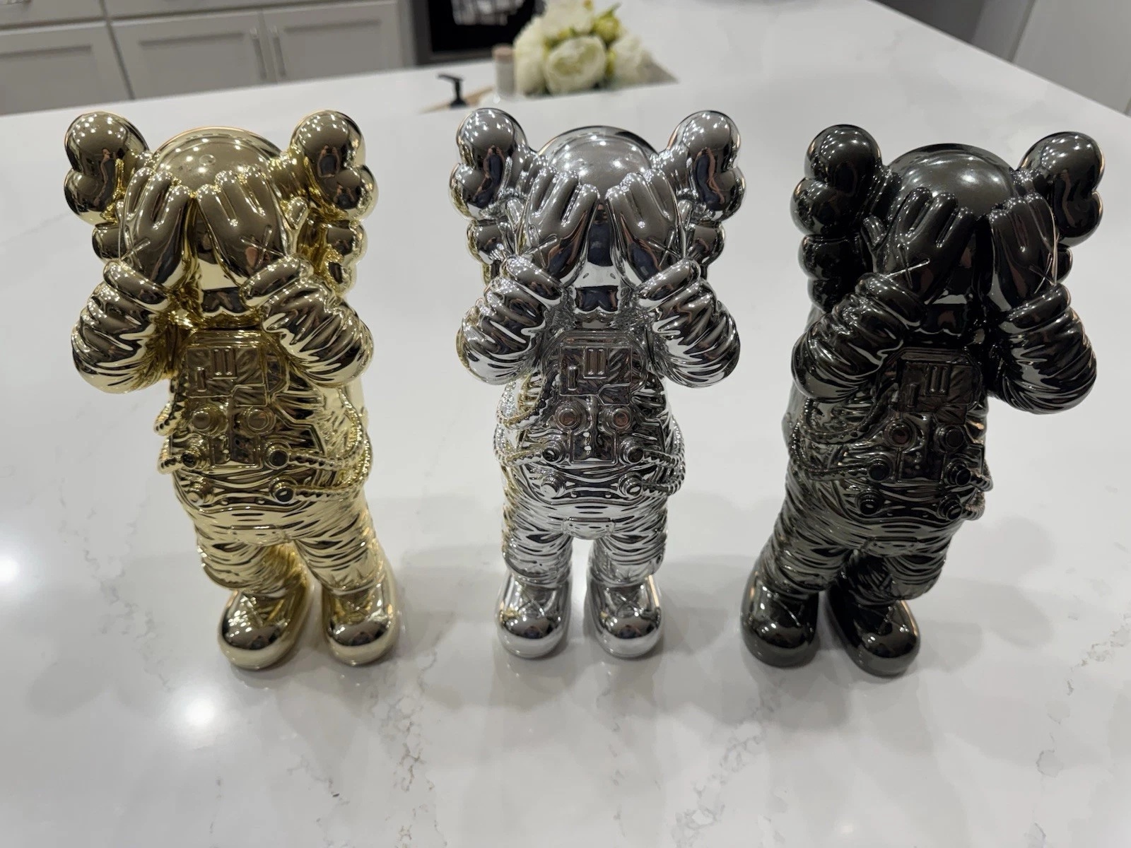 KAWS HOLIDAY SPACE FIGURE SET (GOLD SILVER & BLACK)- COMPLETE SET OF 3 FIGURES