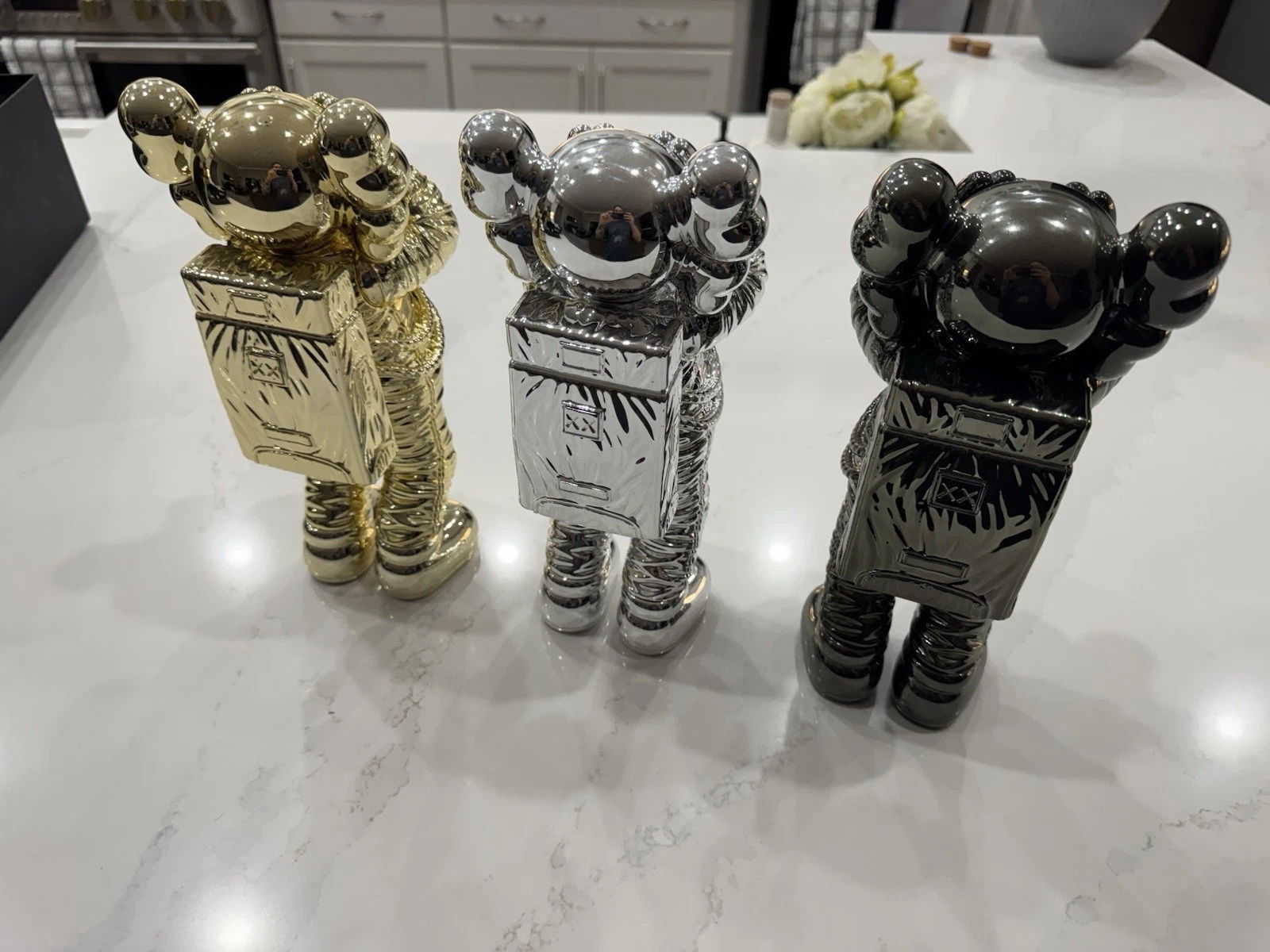 KAWS HOLIDAY SPACE FIGURE SET (GOLD SILVER & BLACK)- COMPLETE SET OF 3 FIGURES