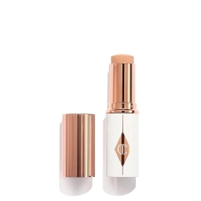 CHARLOTTE TILBURY UNREAL SKIN TINT SHEER GLOW HYDRATING FOUNDATION STICK - LIGHTWEIGHT CREAM